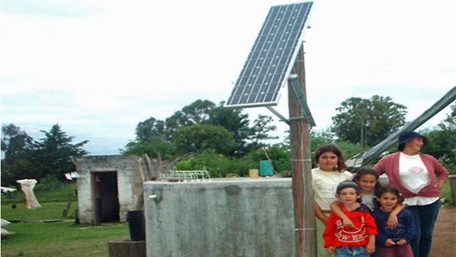 A family at home with their solar panel